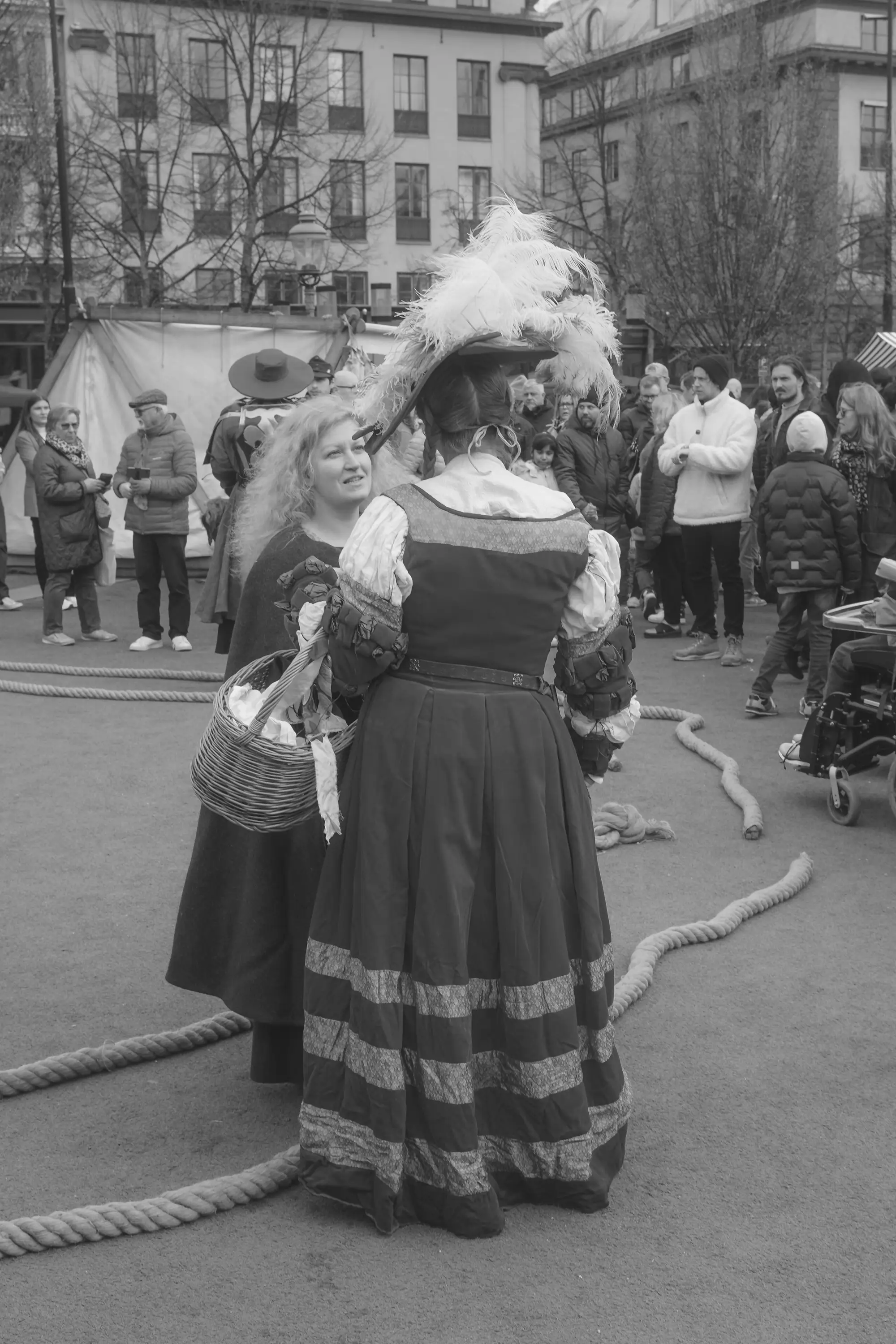 Two women talking, on a costume