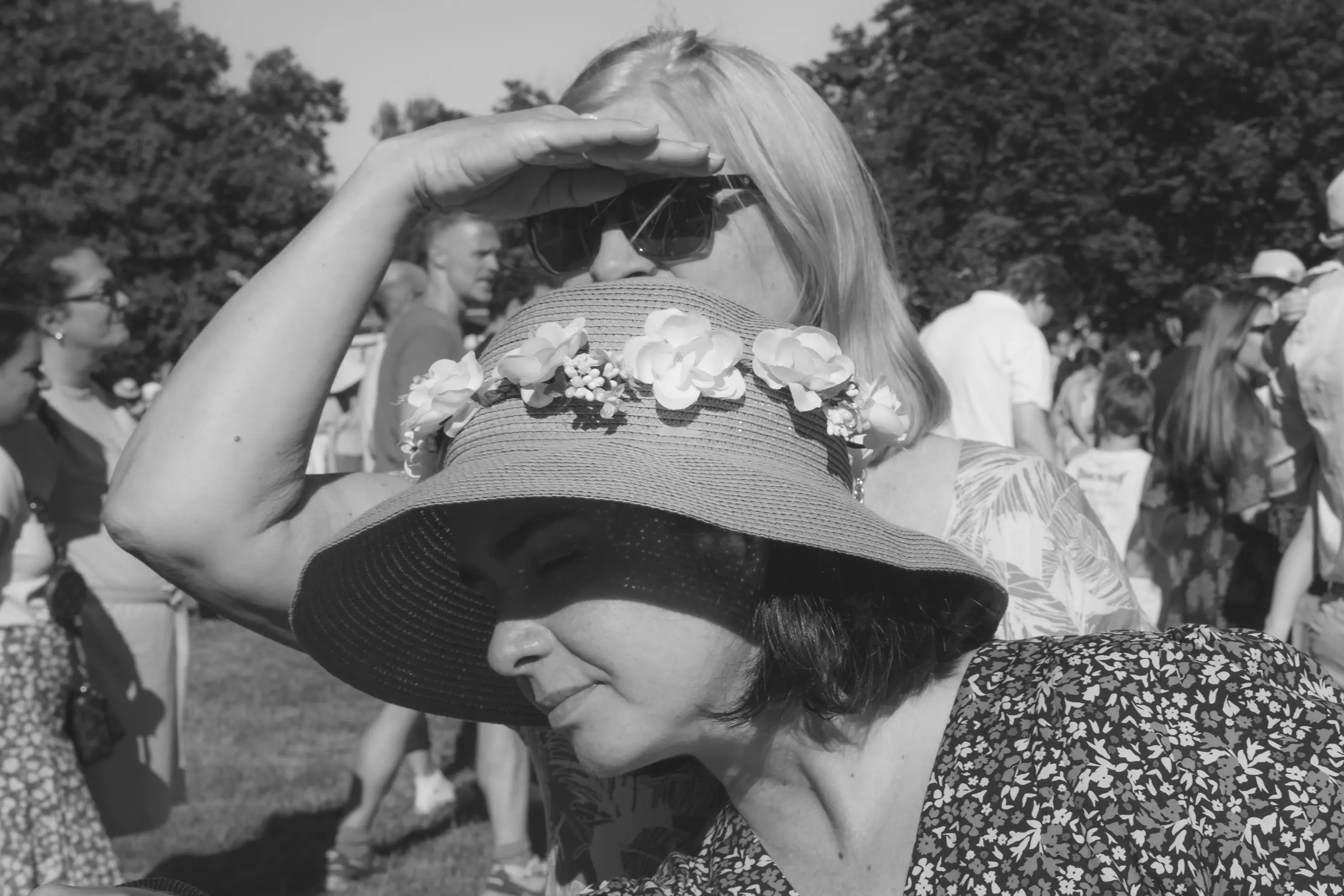 Two woman with hats on Midsommar celebration